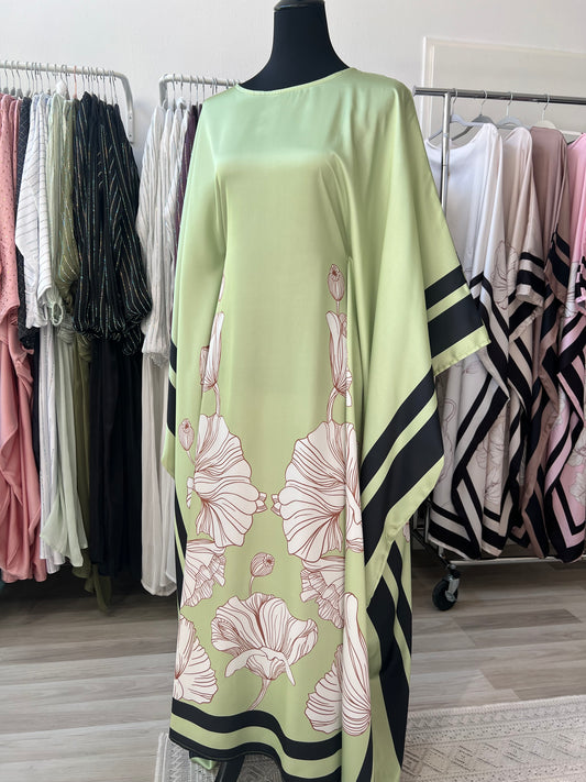 Hellgrünes butterfly abaya mit weißen blumen und scharzen linien